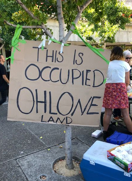 Sign that says "This is occupied Ohlone land."